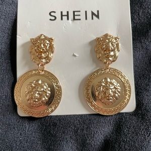 Gold lion earrings